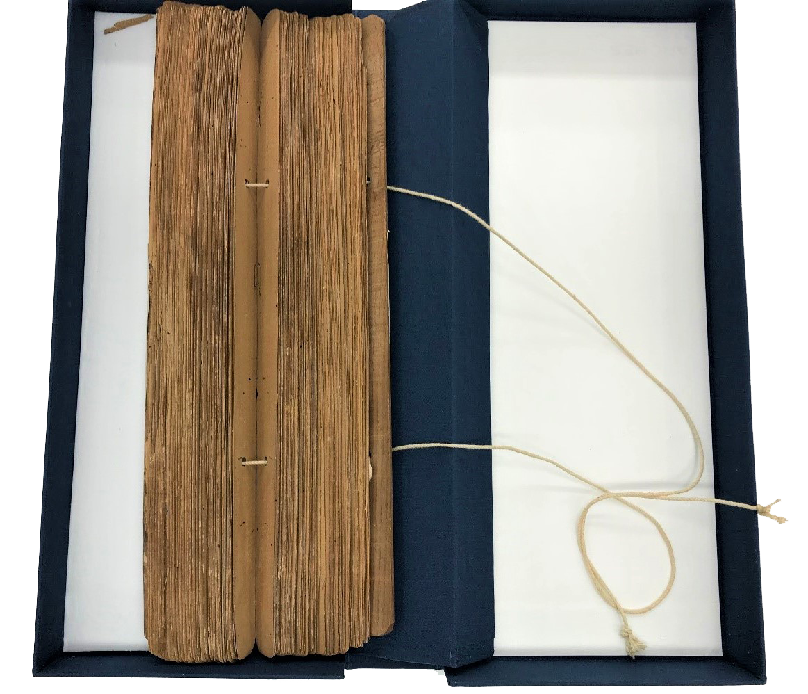 Bound manuscript in open preservation box