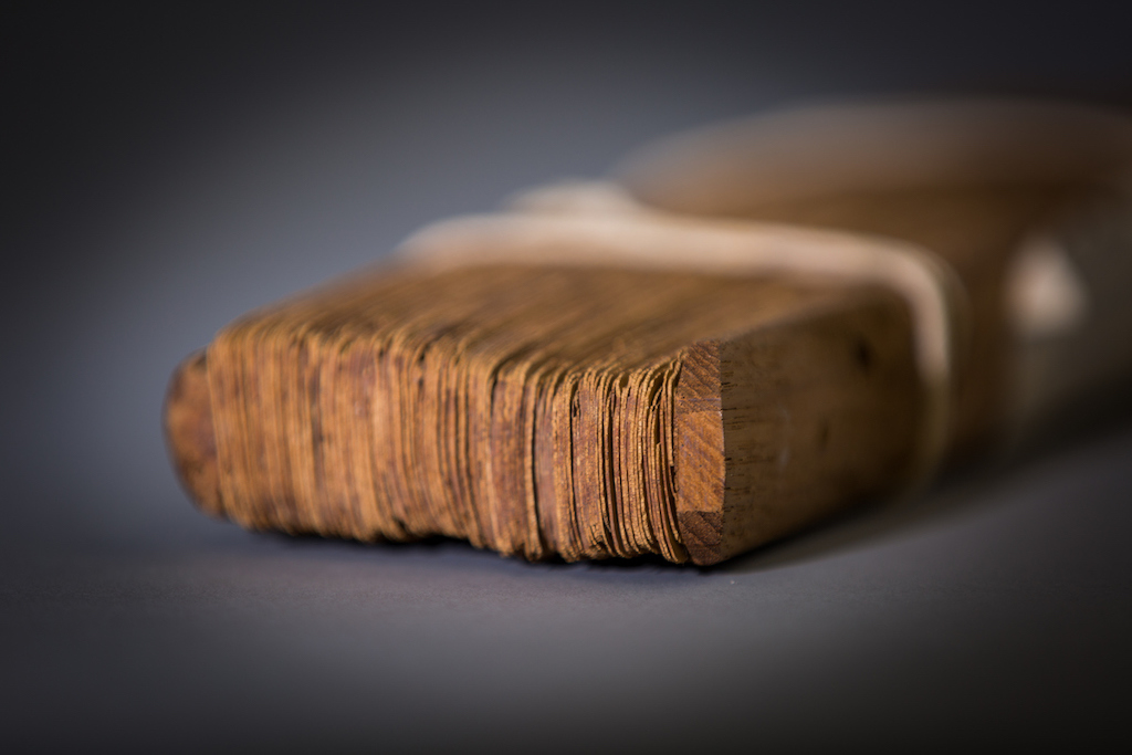 Close shot of end of bound palm leaf manuscript